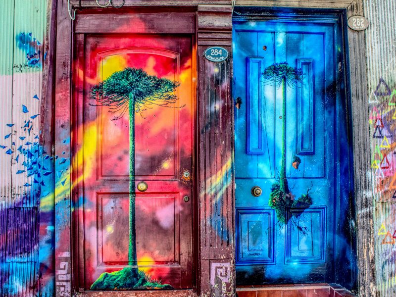 Two painted doors depicting different pieces of art and differing narratives