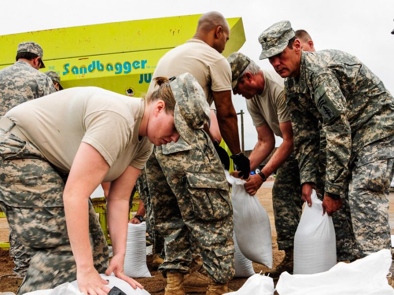 Military personnel assisting with flood relief